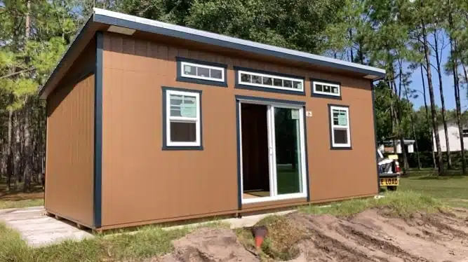 a tan 14x24 shed with a sliding glass door for sale in florida