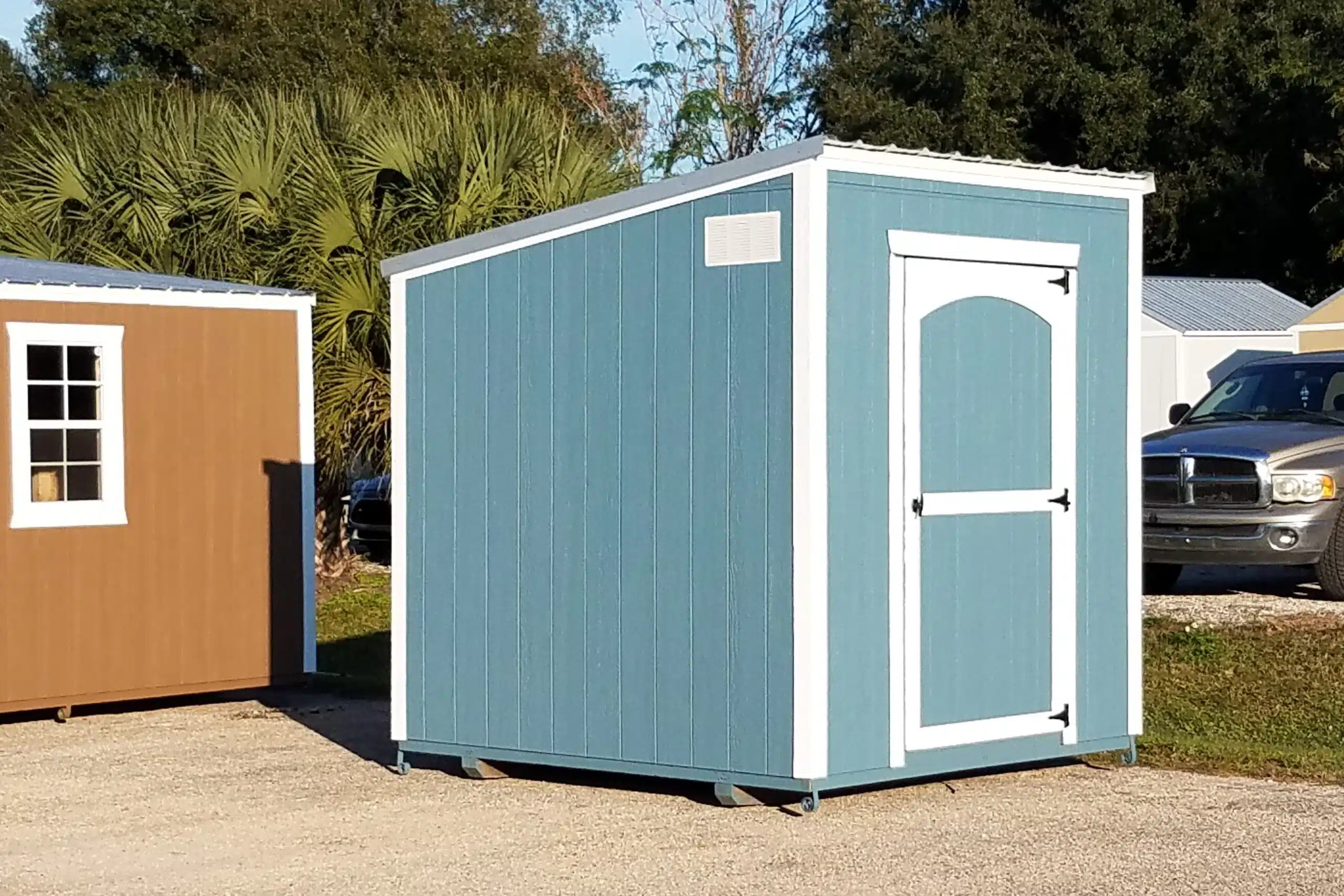 blue studio sheds in myakka city fl with white trim