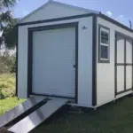 white and black garage shed with double doors and windows in haines city fl