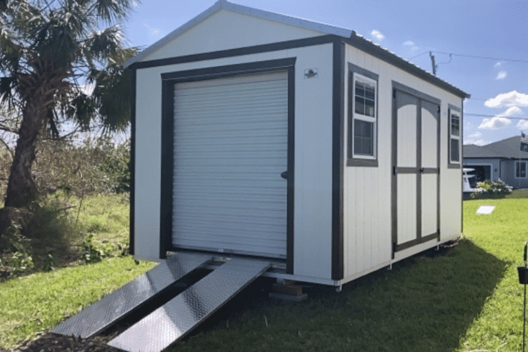 white and black garage shed with double doors and windows in haines city fl