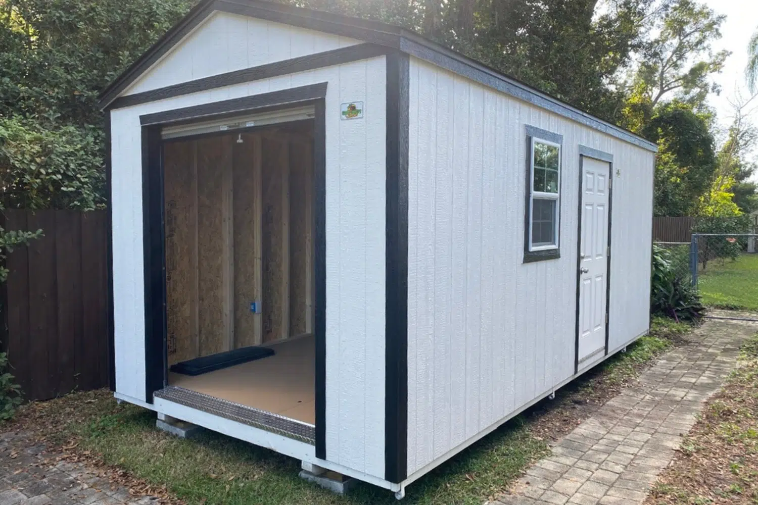 white and black garage shed with side door and window in haines city fl