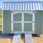 a green storage shed with ramps in orlando fl