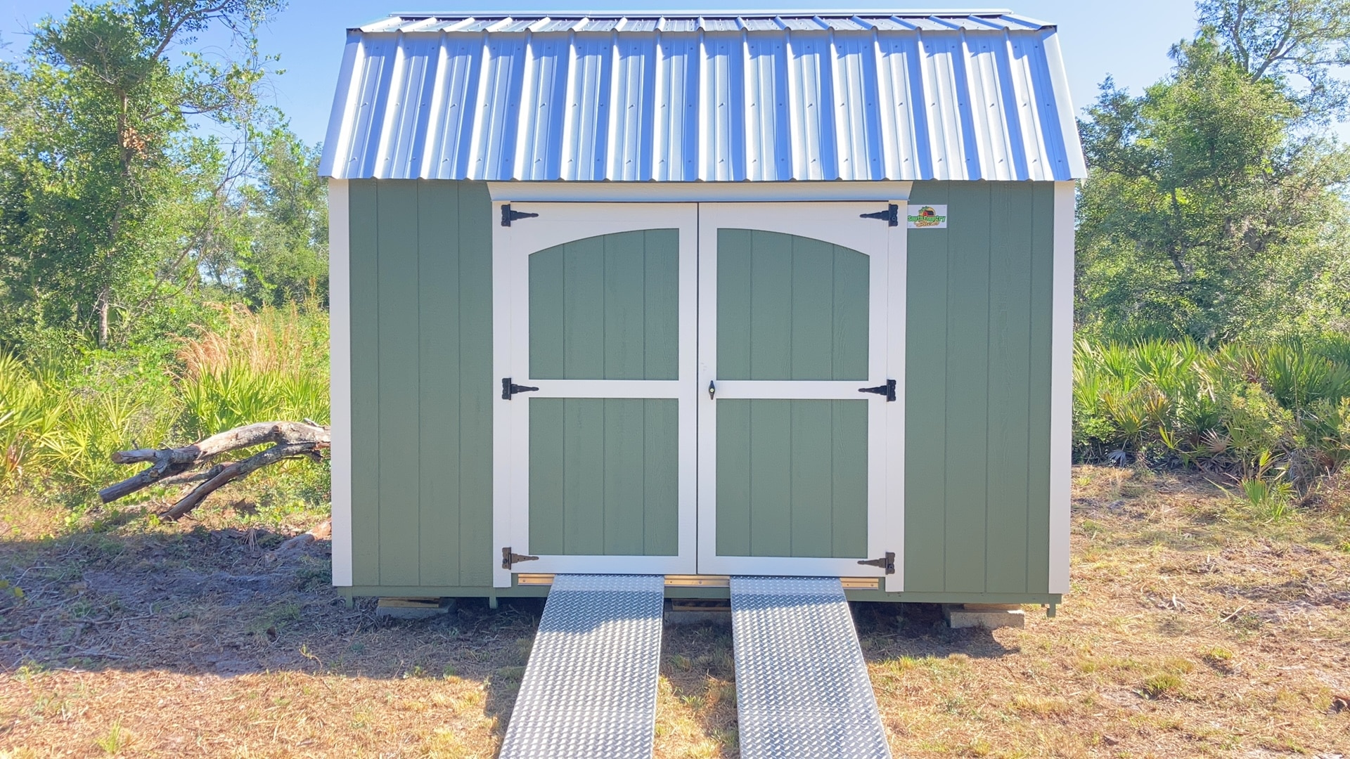 a green storage shed with ramps in orlando fl