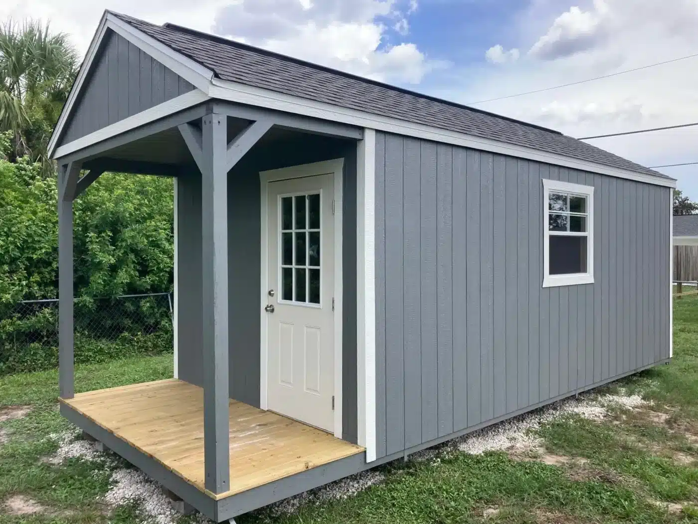 a grey lofted cabin shed built for hurricane-resistance