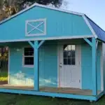 a bright, light blue cabin shed with white trim in bartow fl