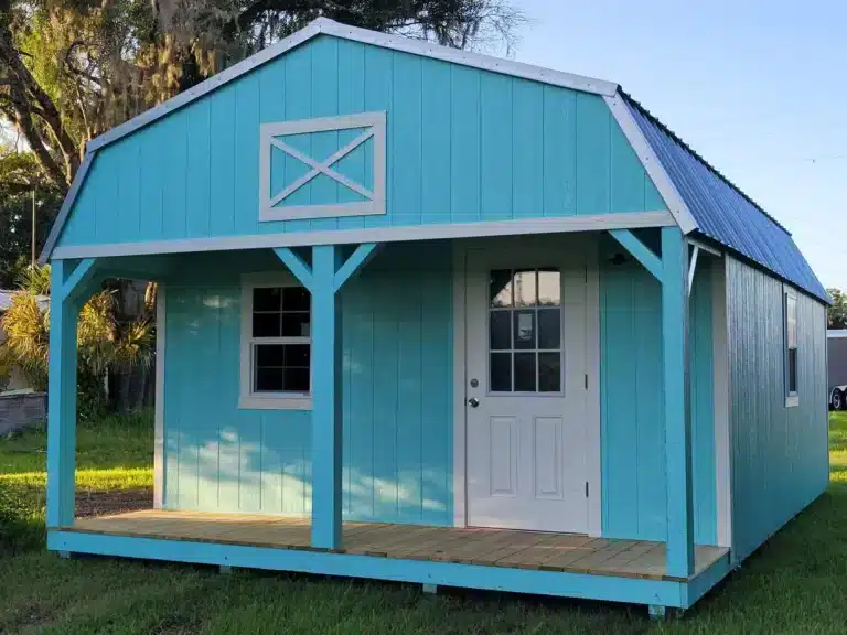 a bright, light blue cabin shed with white trim in bartow fl