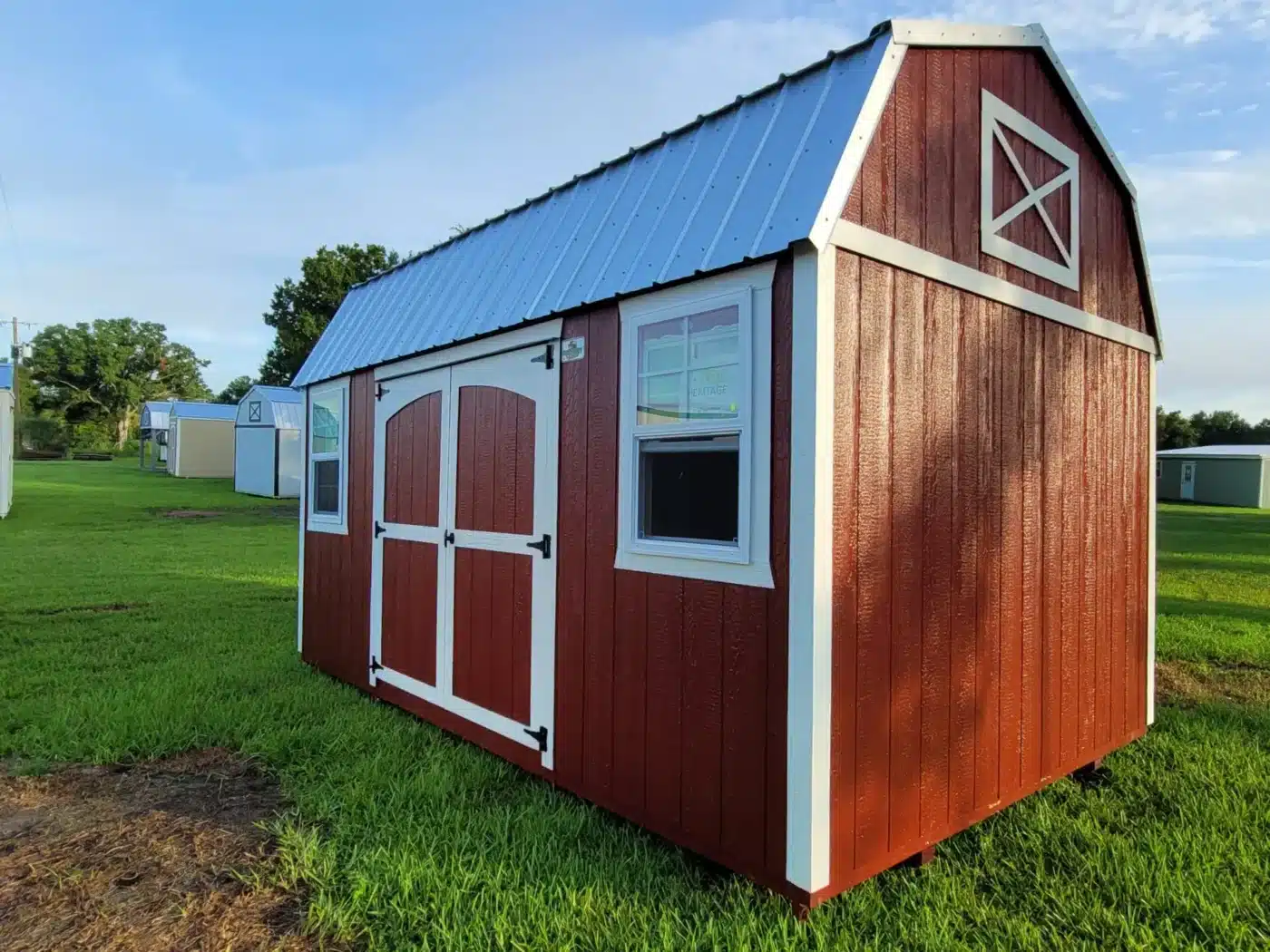 a red, hurricane-rated shed with a metal roof