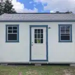 white side gable lofted shed with two windows, blue trim, and a shingle roof